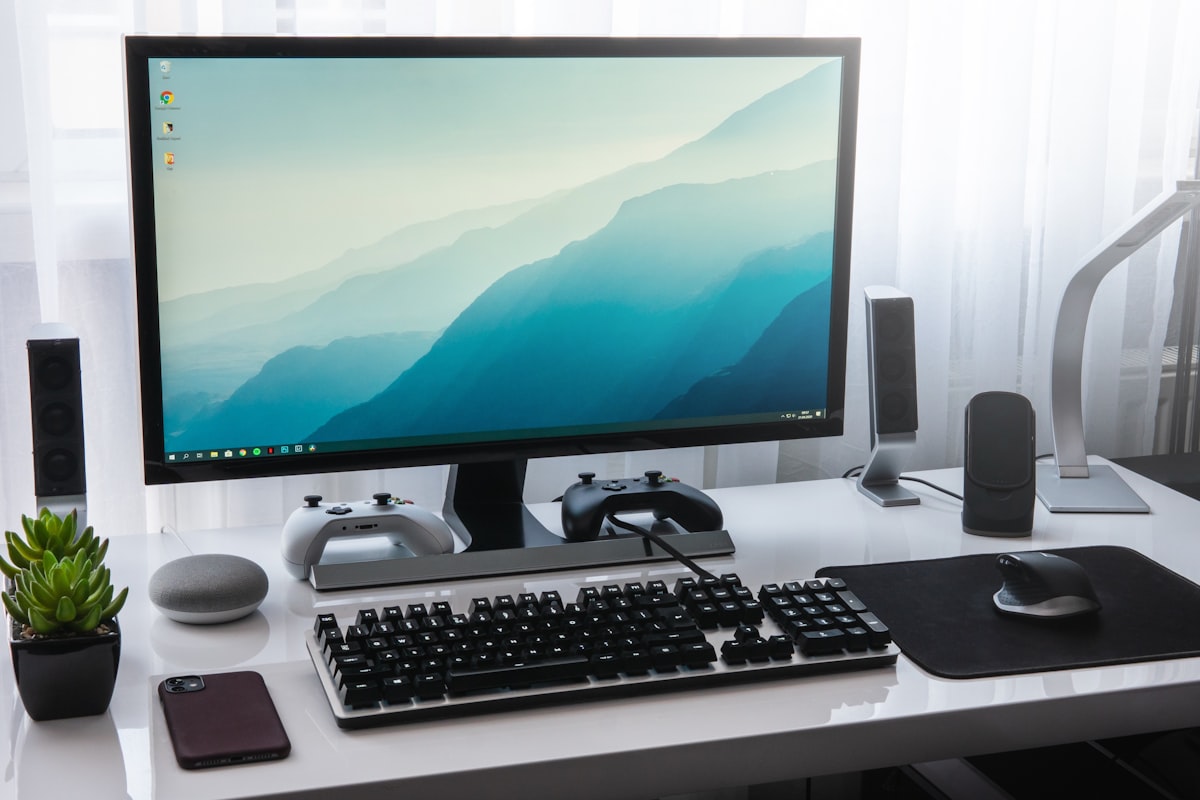 Multiple computer screens showing different operating systems