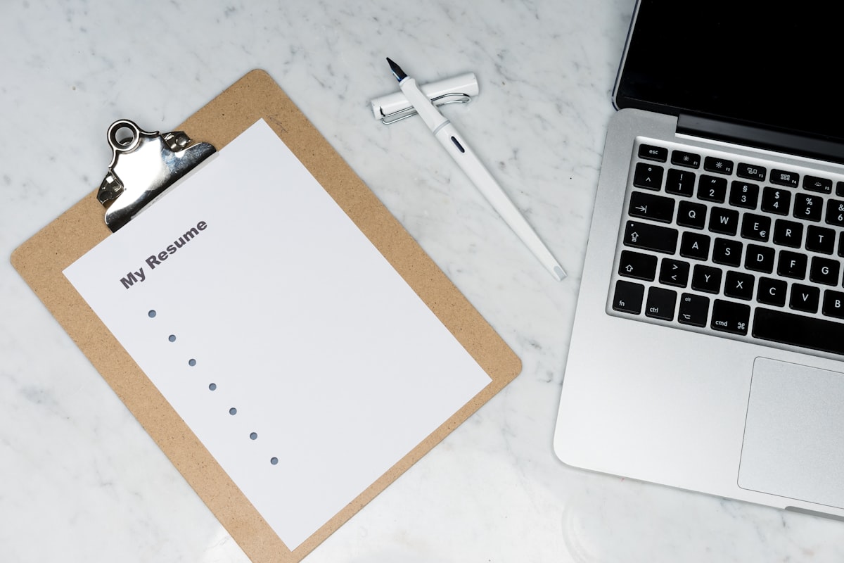 Resume document on a desk with pen