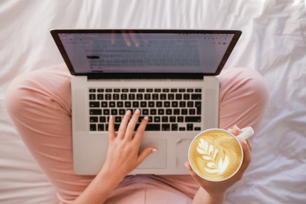 Freelancer working on laptop at a coffee shop