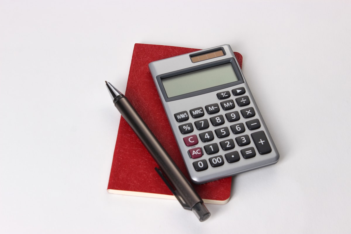 Calculator and notebook for budget planning