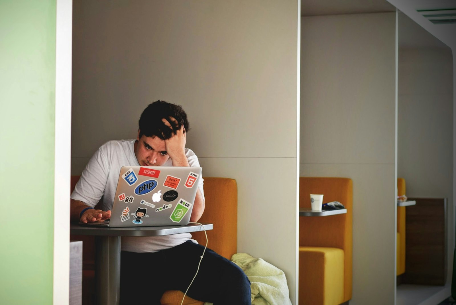 Stressed office worker at a desk after making salary negotiation mistakes
