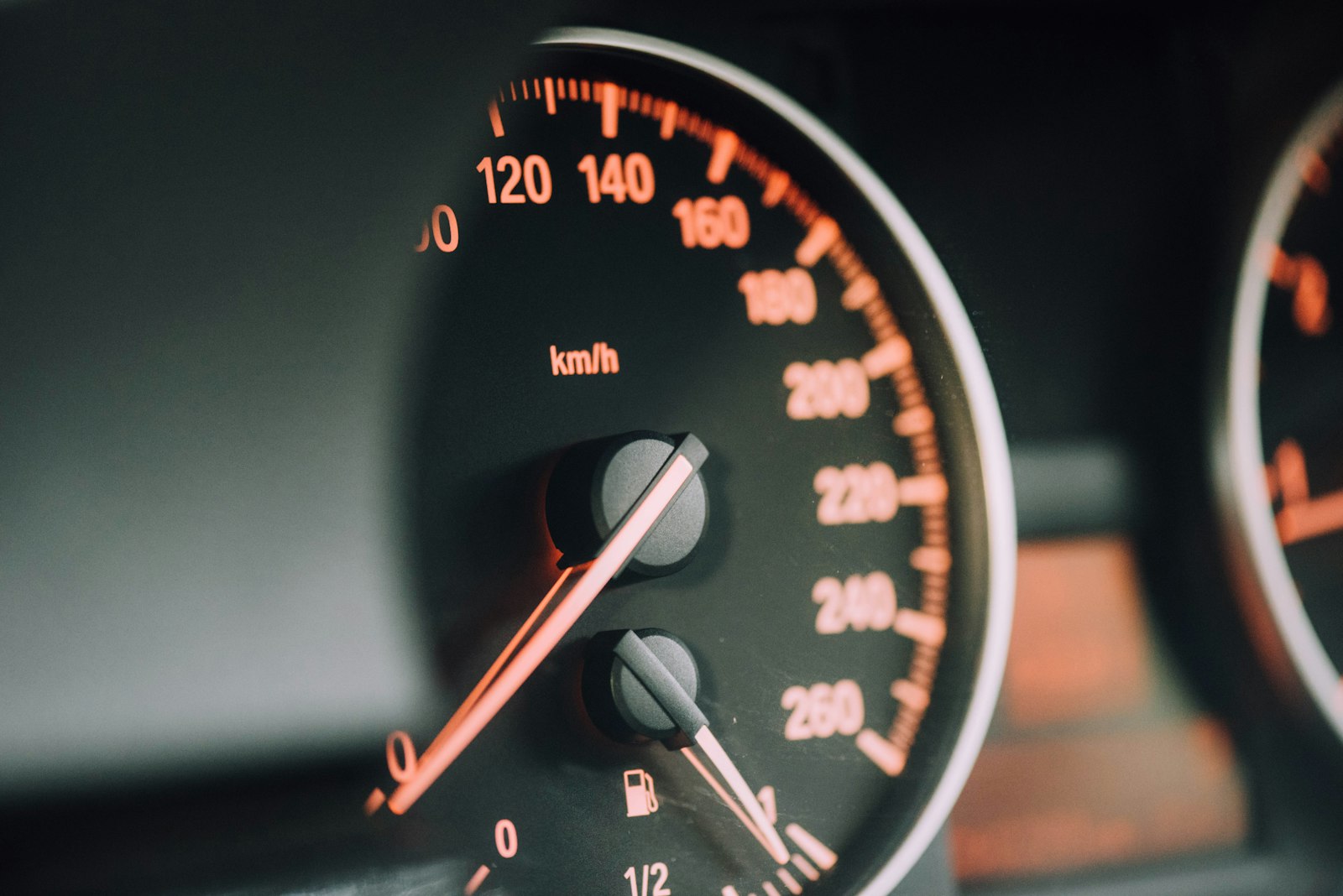 Car speedometer close-up showing high speed, illustrating how a speeding ticket affects insurance rates