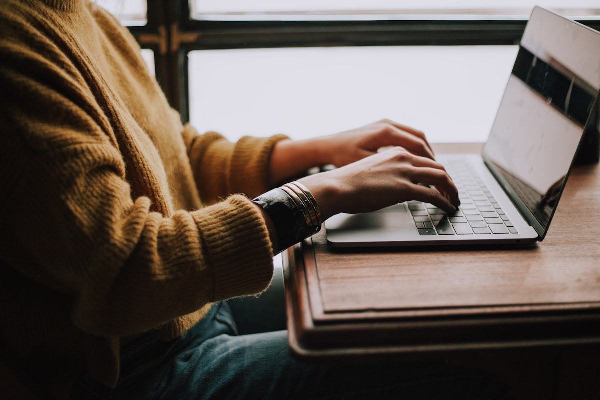 Student learning on laptop with online course