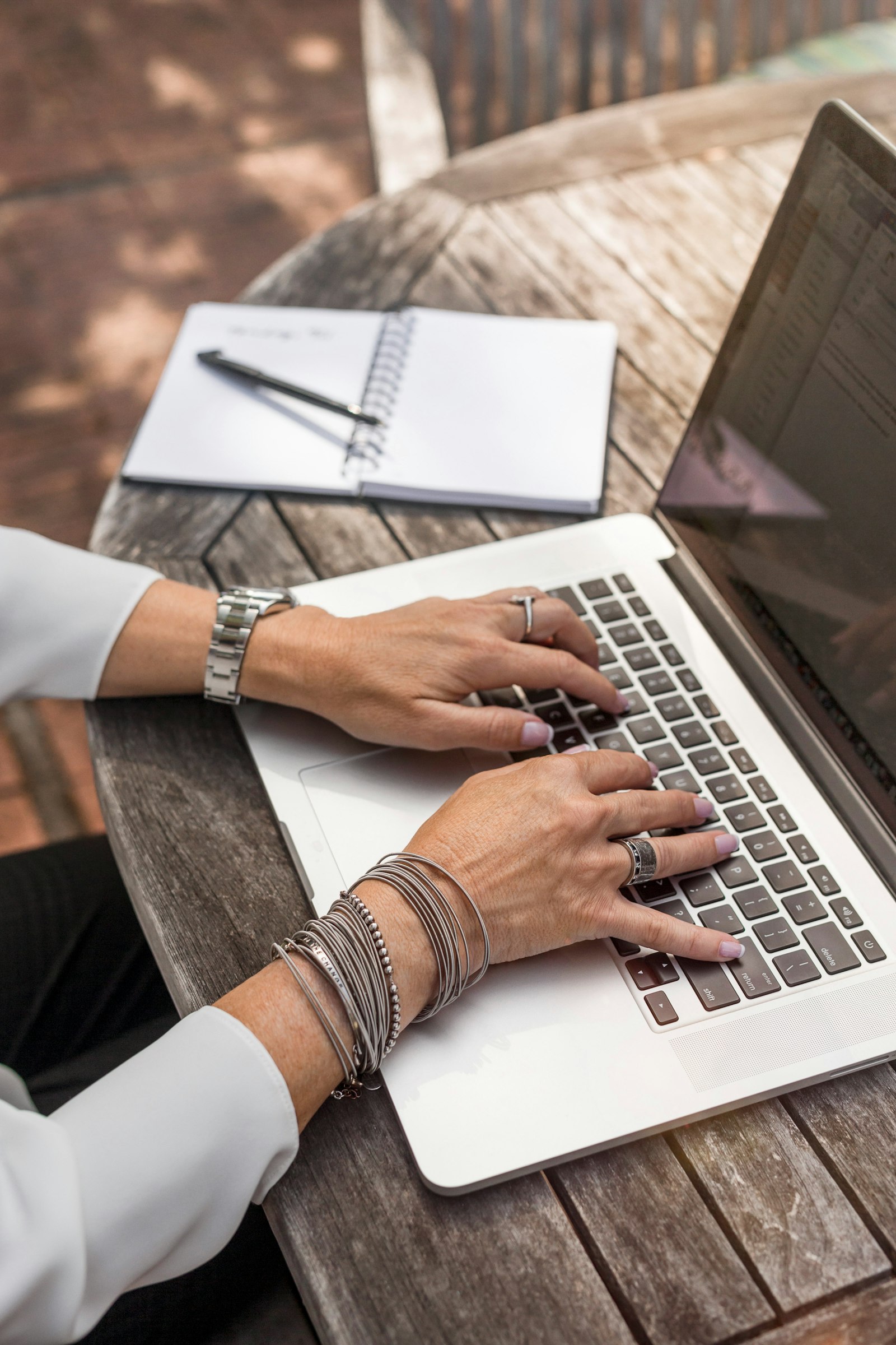 Person writing a salary negotiation script email on a laptop