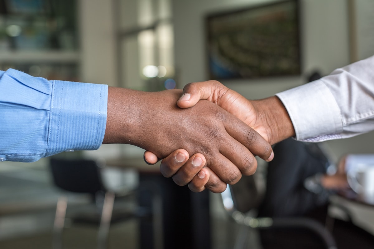 Professional handshake during salary negotiation