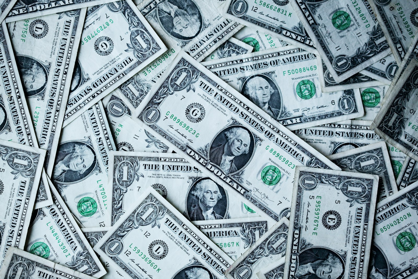 US dollar bills spread out representing collecting a court judgment